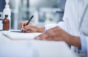 a close-up of a hand holding a pen